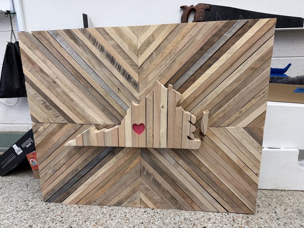 Large wooden wall art with diagonal strip background, Virginia state silhouette, and red heart accent.